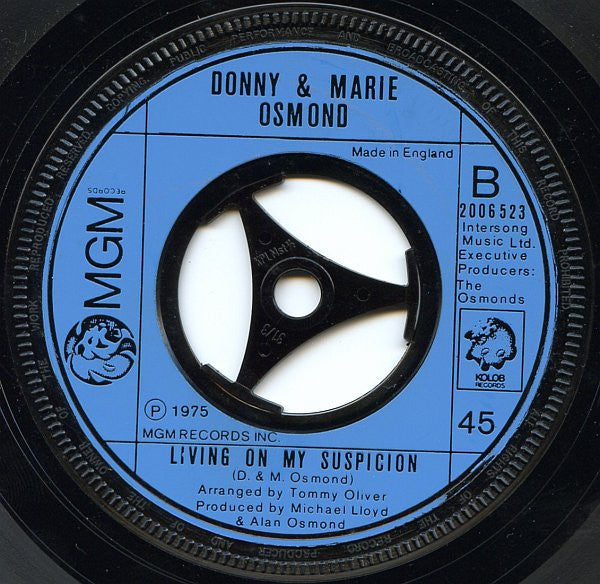 Donny & Marie Osmond : Make The World Go Away / Living On My Suspicion (7", Single, Lar)